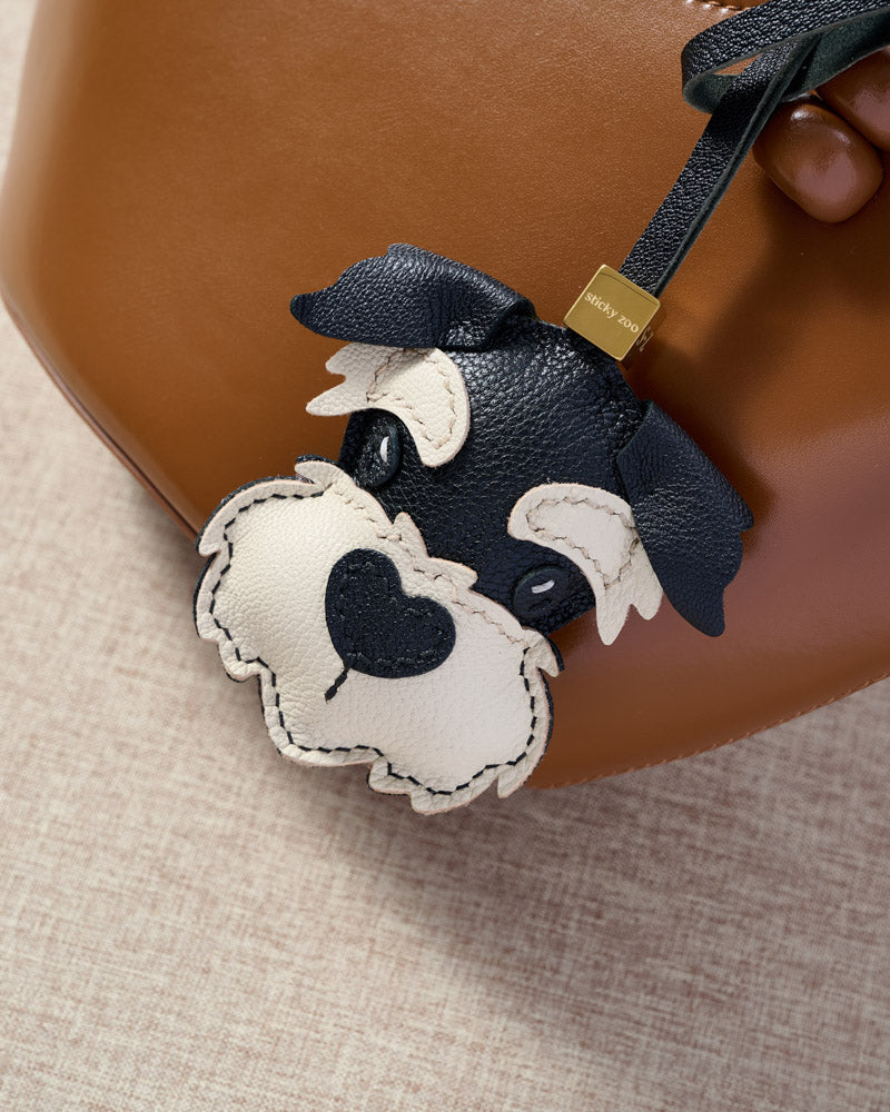 Every panel of the black schnauzer charm is cut by hand and stitched through real French leather. Layered slowly for depth — no prints, no stamps.