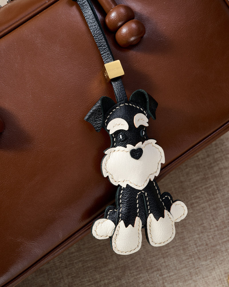 Every panel of the black urban schnauzer charm is cut by hand and stitched through real French leather. Layered slowly for depth — no prints, no stamps.