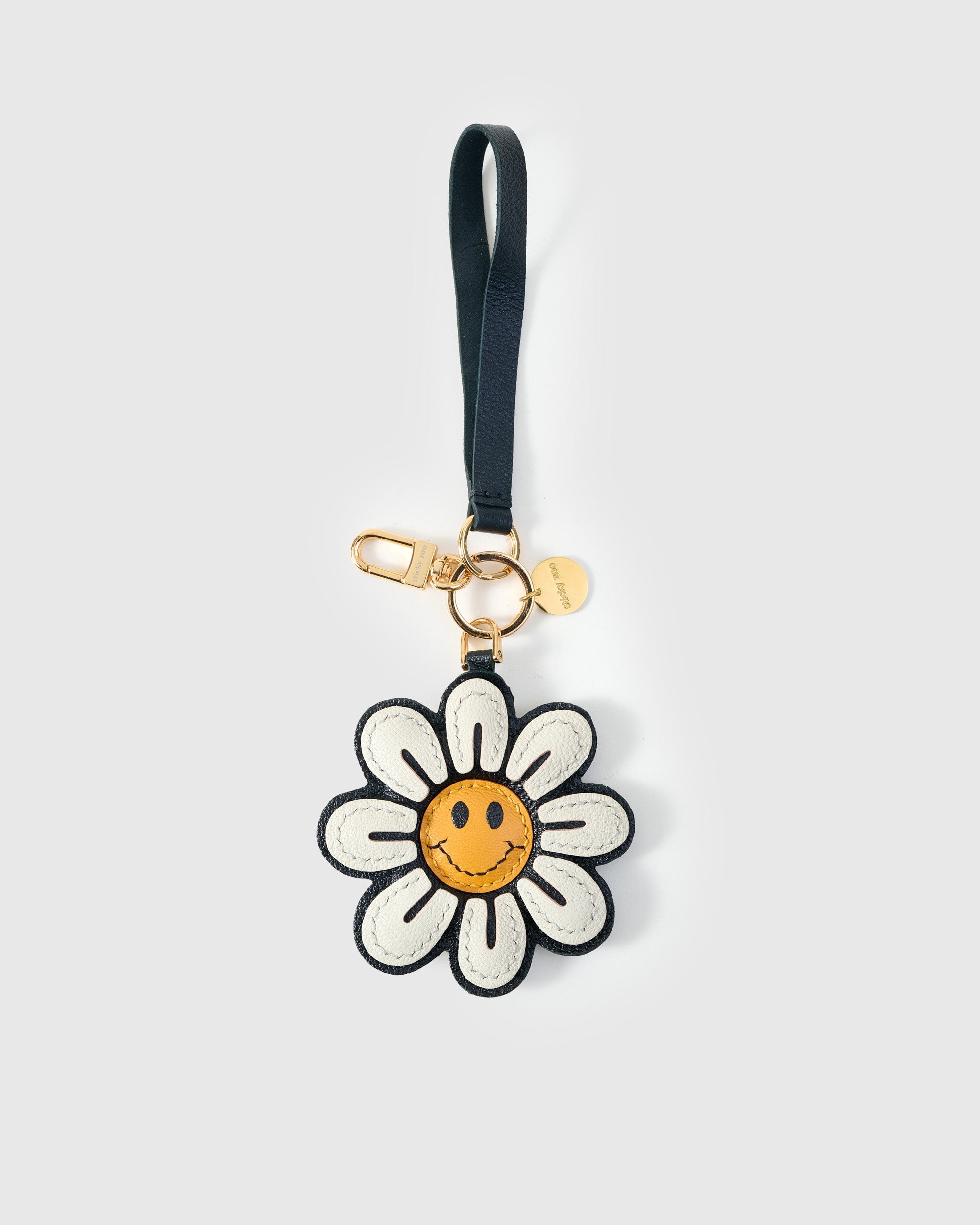 STICKYZOO Smile Flower Charm in white and golden yellow French Alran goatskin. Hand-cut, hand-stitched. Designed in Amsterdam.