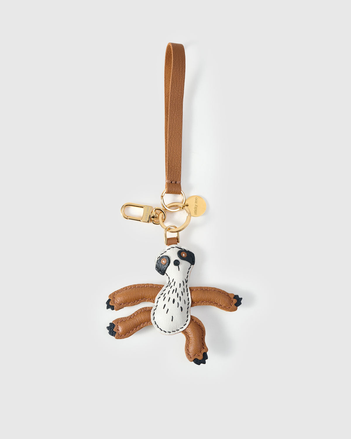 SLOTH CHARM on an 18K gold-plated keychain clip with engraved STICKYZOO disc — clips to keys, bags or backpacks.