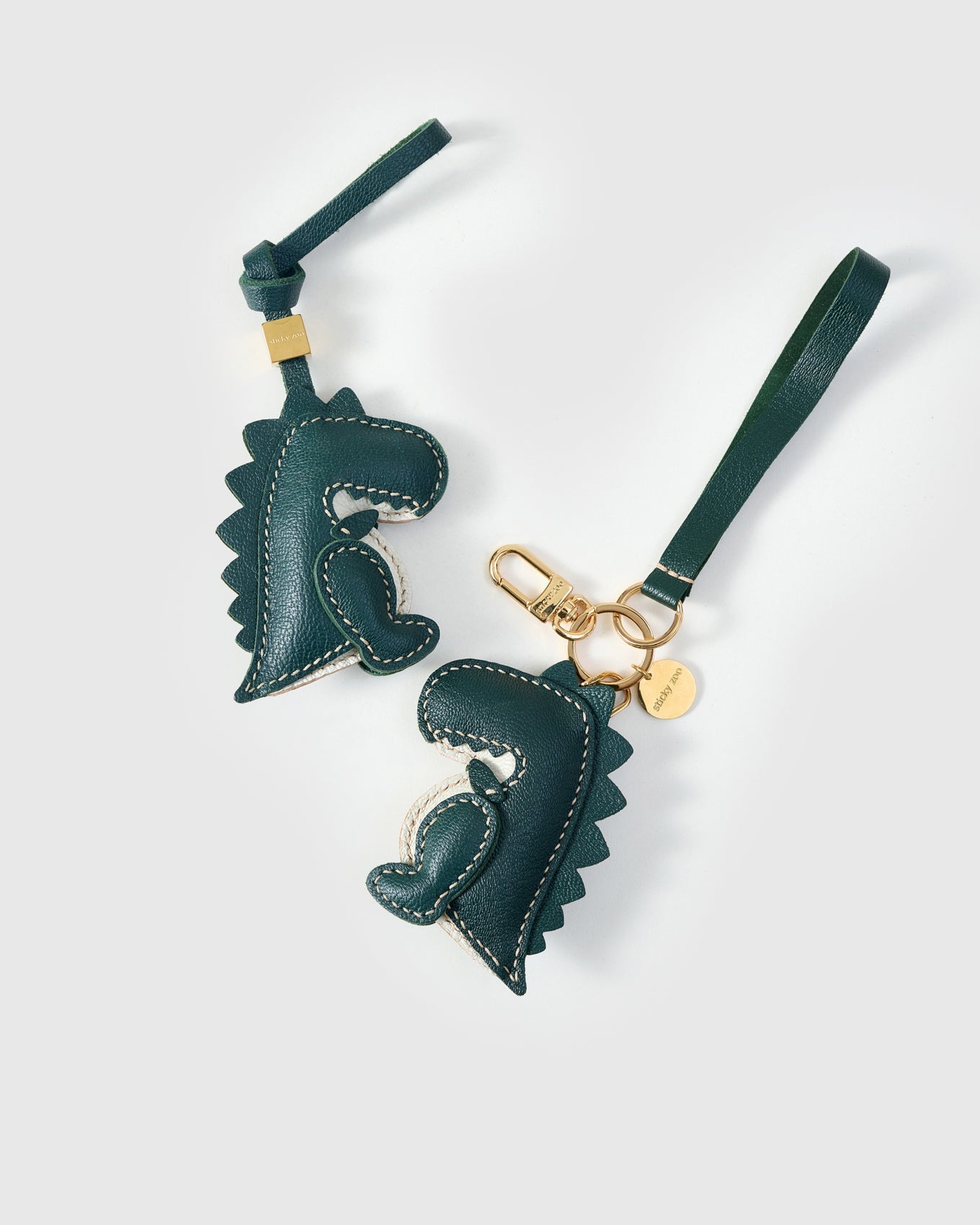 Green dinosaur — genuine French Alran goatskin. Never vegan. Never synthetic.