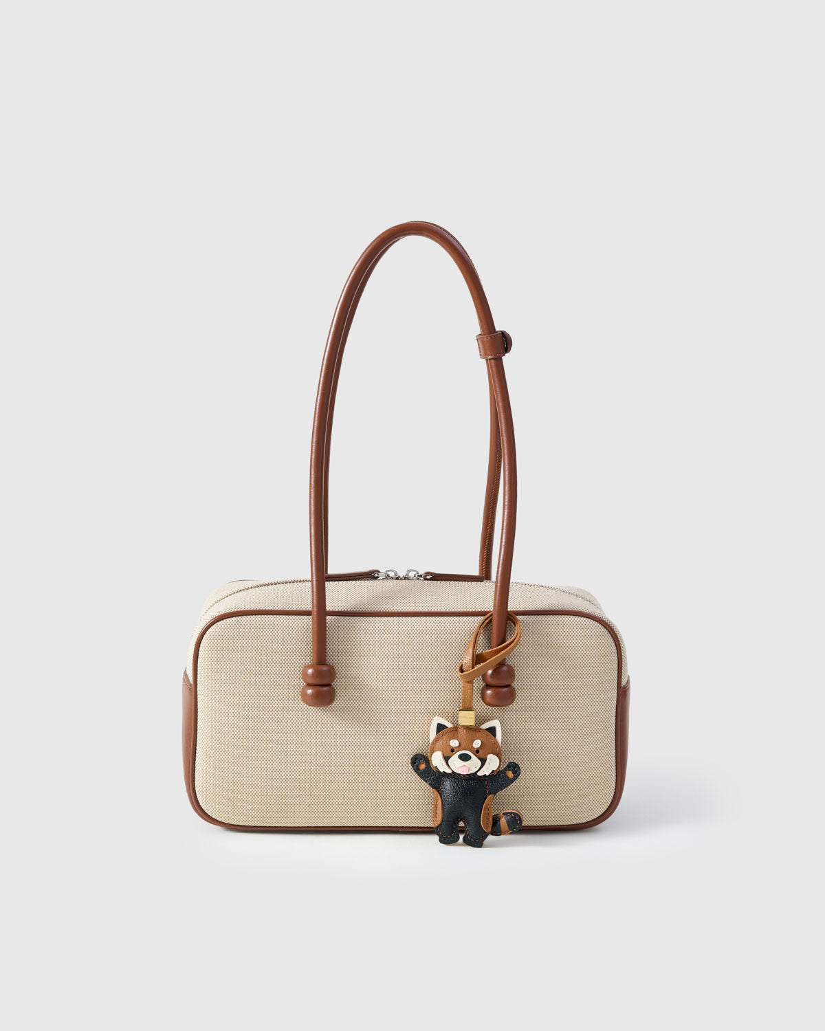 RED PANDA CHARM charm styled on a bag — a small, specific piece that turns a simple bag into a personal one.