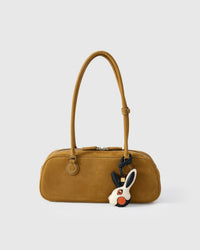 RABBIT CHARM charm styled on a bag — a small, specific piece that turns a simple bag into a personal one.
