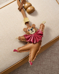BALLET BEAR CHARM charm styled on a bag — a small, specific piece that turns a simple bag into a personal one.
