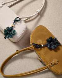 STICKYZOO Lucky Clover Charm in black padded 3D — handmade French Alran goatskin, hand-cut and hand-stitched over 3 days.