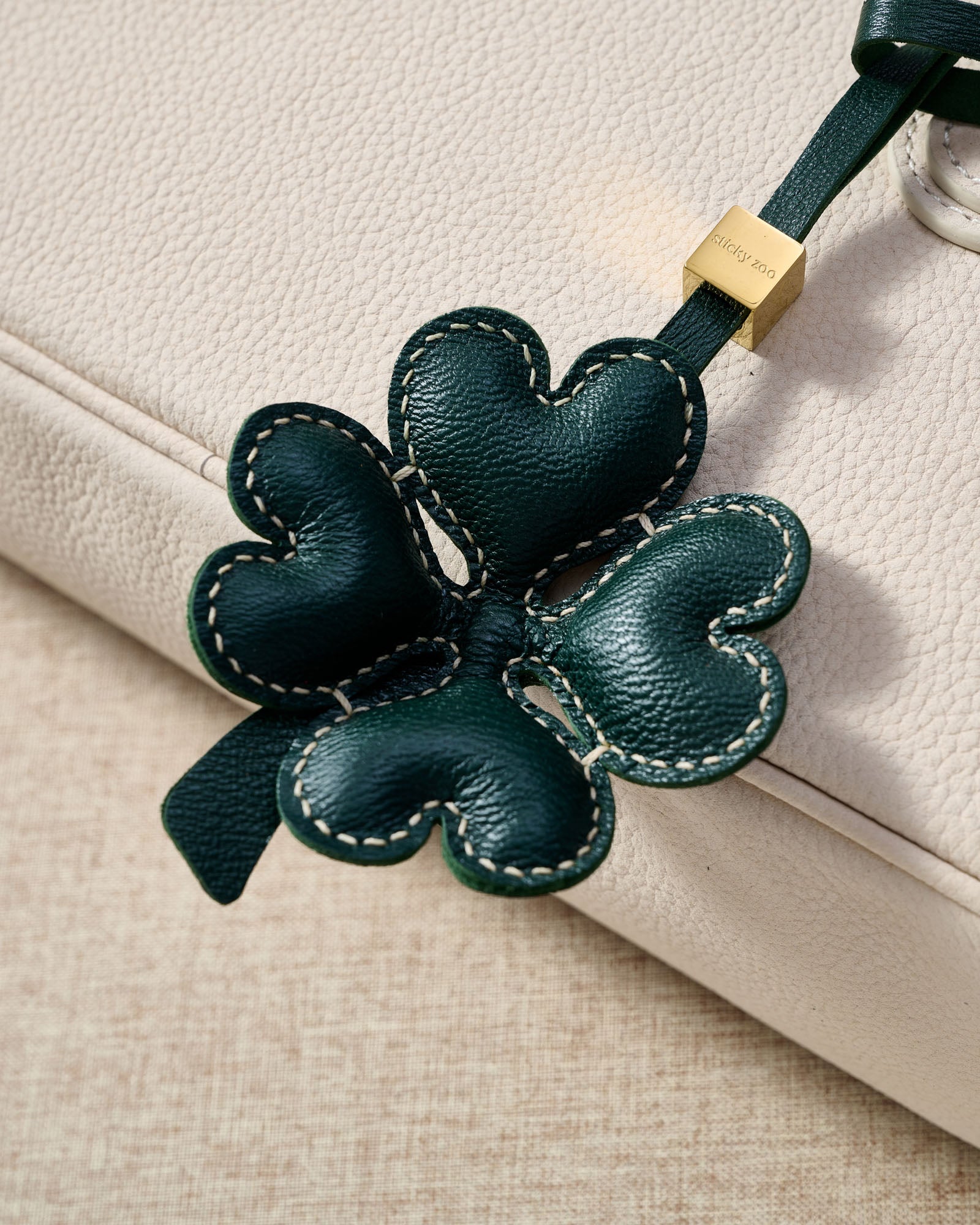 STICKYZOO Lucky Clover Charm in forest green padded 3D — handmade French Alran goatskin with 18K gold-plated hardware. Arrives gift-ready.