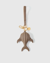 Taupe whale charm — dimensional puffed body, not flat. Real French Alran goatskin, stitched by hand.