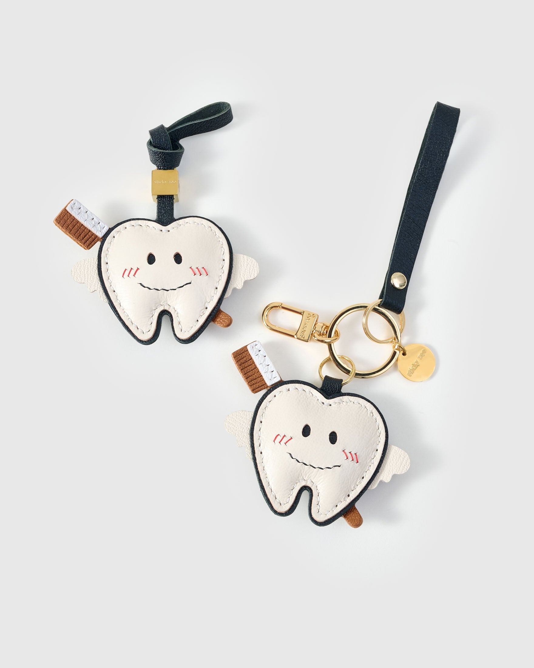 Tooth fairy charm — real French leather, 3 days by hand.