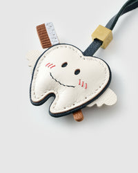 Tooth fairy charm — finished one at a time, by hand.