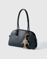 Taupe whale — finished one at a time, by hand.