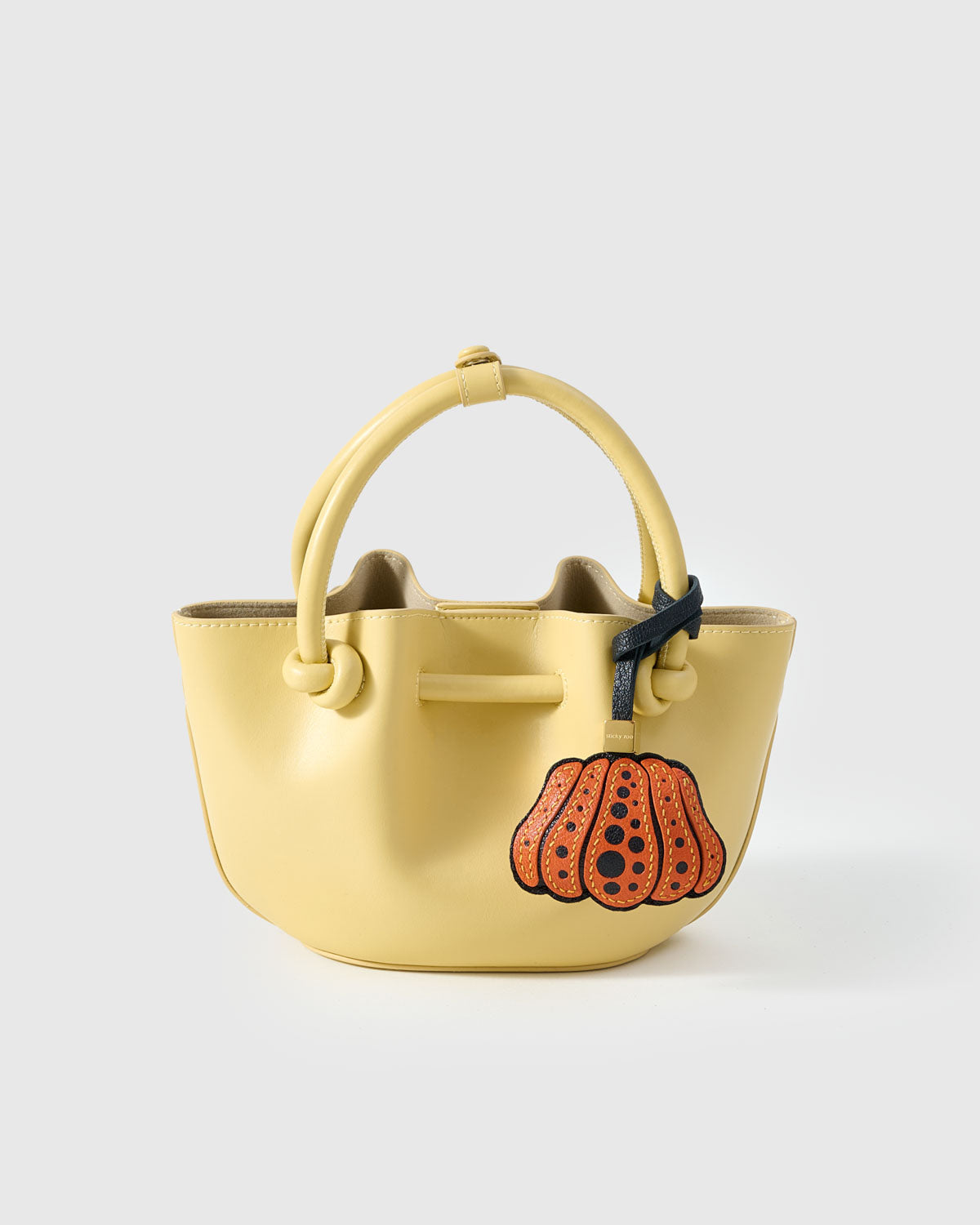 Every panel of the pumpkin charm is cut by hand and stitched through real French leather. Layered slowly for depth — no prints, no stamps.