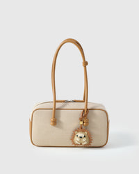HEDGEHOG CHARM charm styled on a bag — a small, specific piece that turns a simple bag into a personal one.