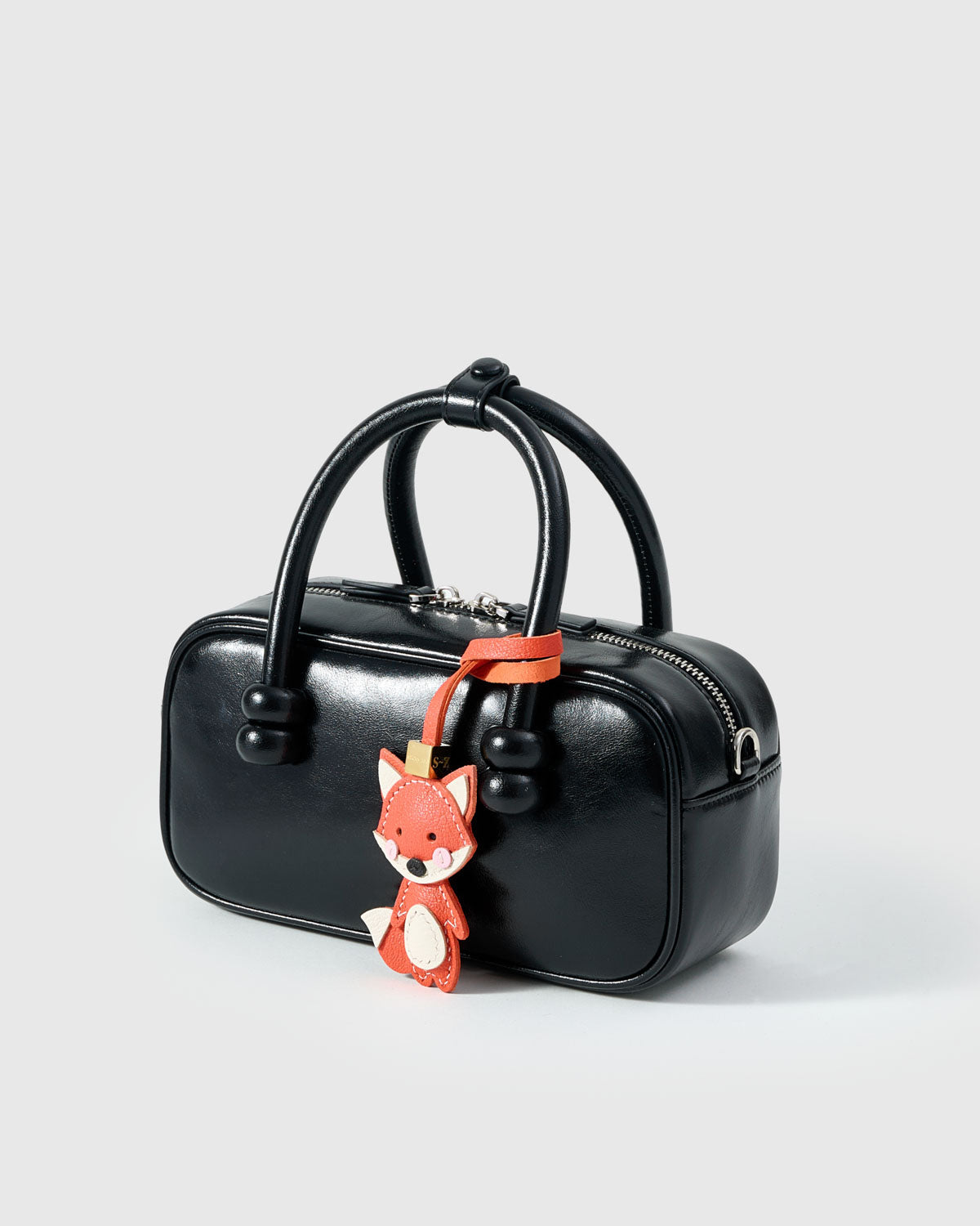 FOX CHARM charm on a bag — real French Alran leather, 3 days by hand.