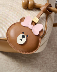 CUDDLY BEAR CHARM on an 18K gold-plated keychain clip with engraved STICKYZOO disc — clips to keys, bags or backpacks.