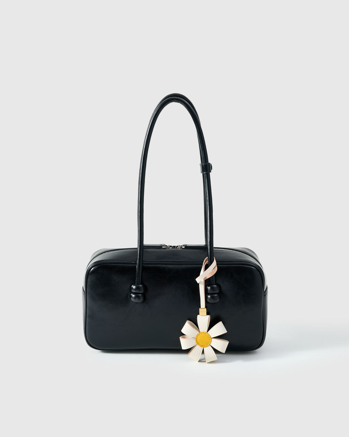 STICKYZOO Daisy Bag Charm in white with yellow centre — handmade French Alran goatskin with 18K gold-plated hardware. Arrives gift-ready.