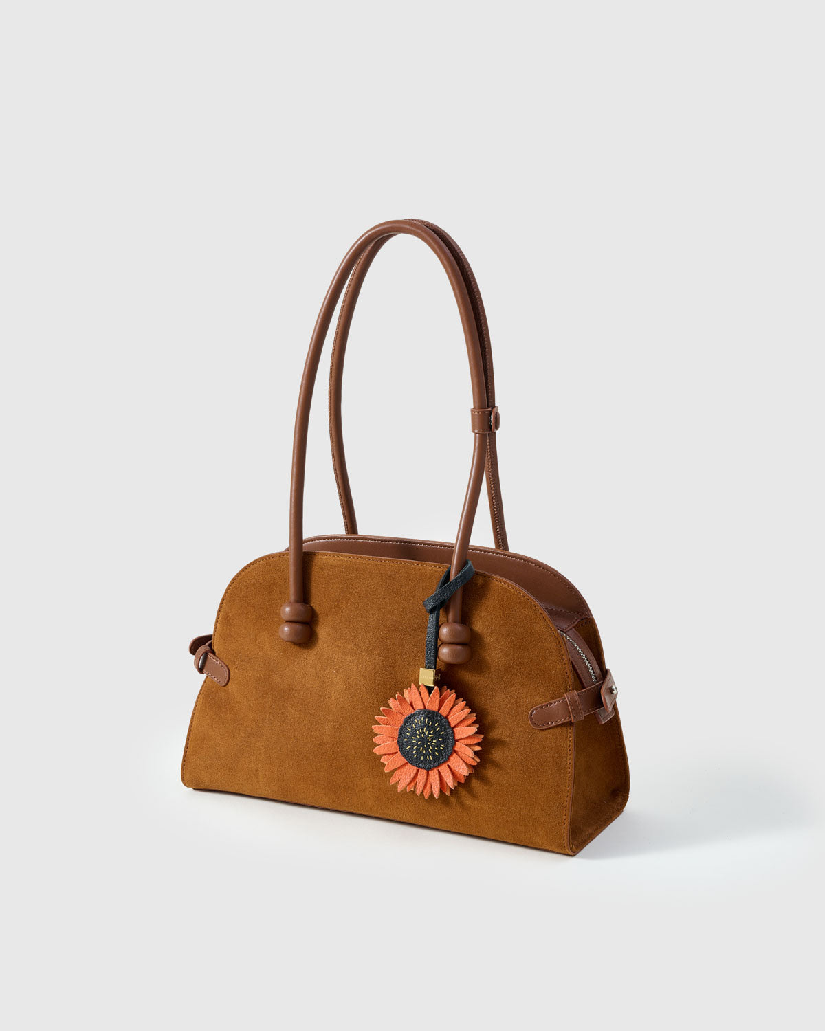 STICKYZOO Sunflower Charm with engraved gold hardware cube — handmade French Alran goatskin, rust orange over dark navy.