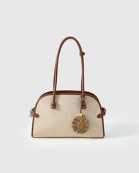STICKYZOO Daisy Charm clipped to a handbag — handmade French Alran goatskin in taupe and olive. 3-day artisan build.