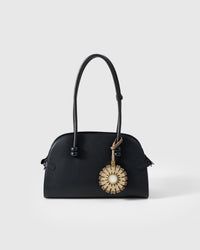 STICKYZOO Sunflower Charm — hand-cut, hand-stitched layered sunflower petals with white centre in French Alran goatskin. Designed in Amsterdam.