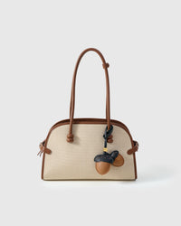 STICKYZOO Acorns Charm in warm tan with dark navy caps — handmade French Alran goatskin with 18K gold-plated hardware. Arrives gift-ready.