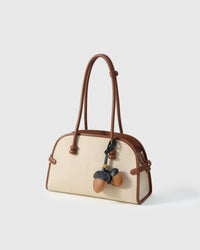 STICKYZOO Acorns Charm with engraved gold hardware cube — handmade French Alran goatskin, warm tan with dark navy caps.