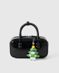 Kitten In Christmas Tree on a bag, side angle — loved by thousands of cat people. Real French leather, 3 days by hand.