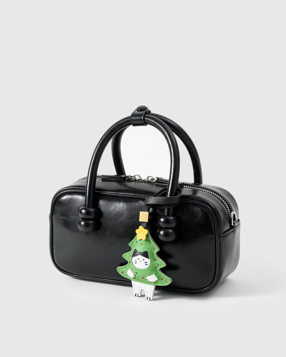 Kitten In Christmas Tree charm — genuine French Alran goatskin. Never vegan. Never synthetic. The difference shows.
