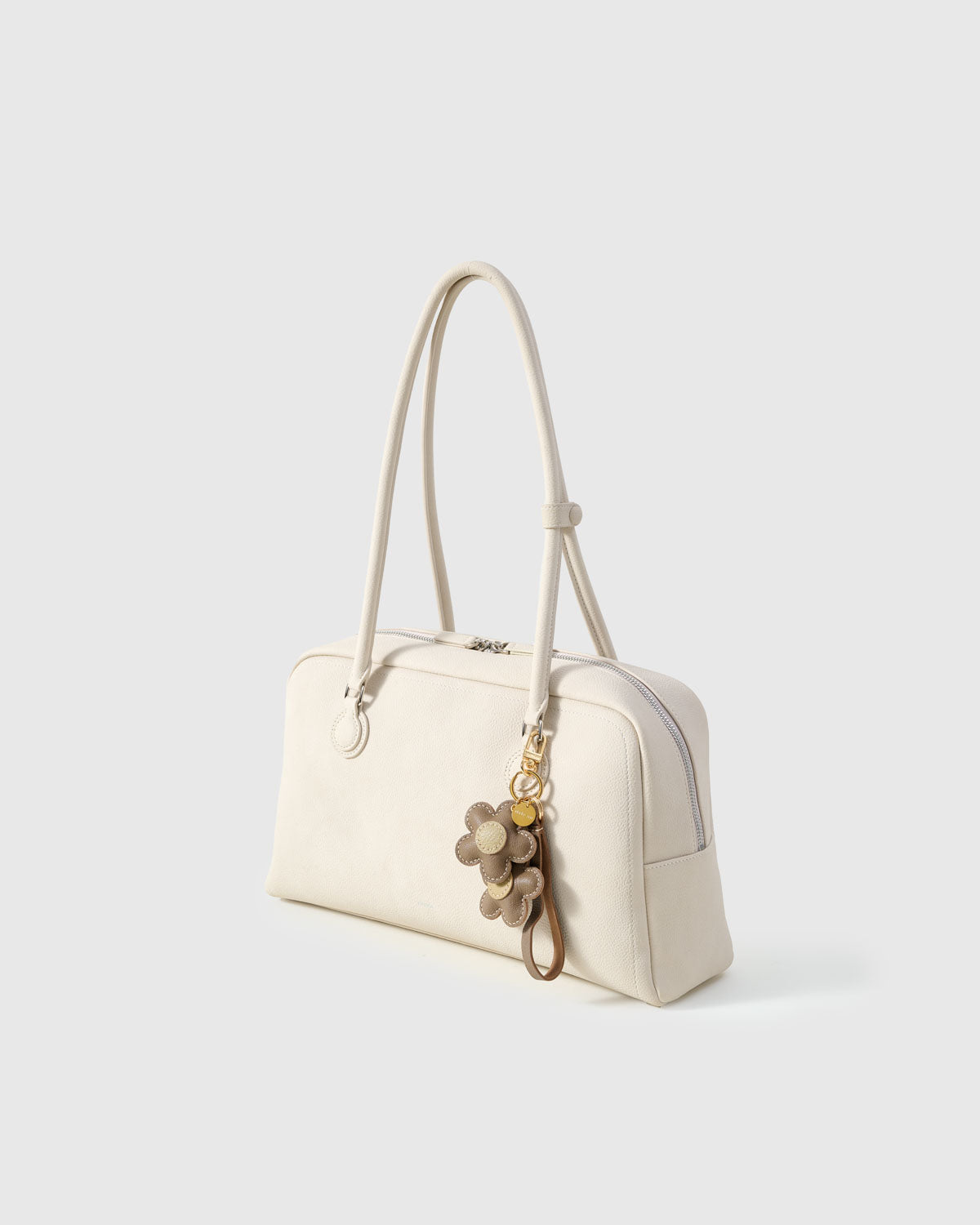 STICKYZOO Twin Flowers Charm — hand-layered French Alran goatskin, twin five-petal blooms on gold keychain. Designed in Amsterdam.
