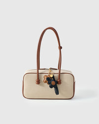 STICKYZOO Twin Flowers Charm in navy and caramel mixed French Alran goatskin. Hand-cut, hand-stitched. Designed in Amsterdam.