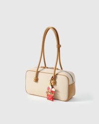 Both editions of the Teddy Bear Gift — leather strap loop for bags, or 18K gold-plated keychain clip.
