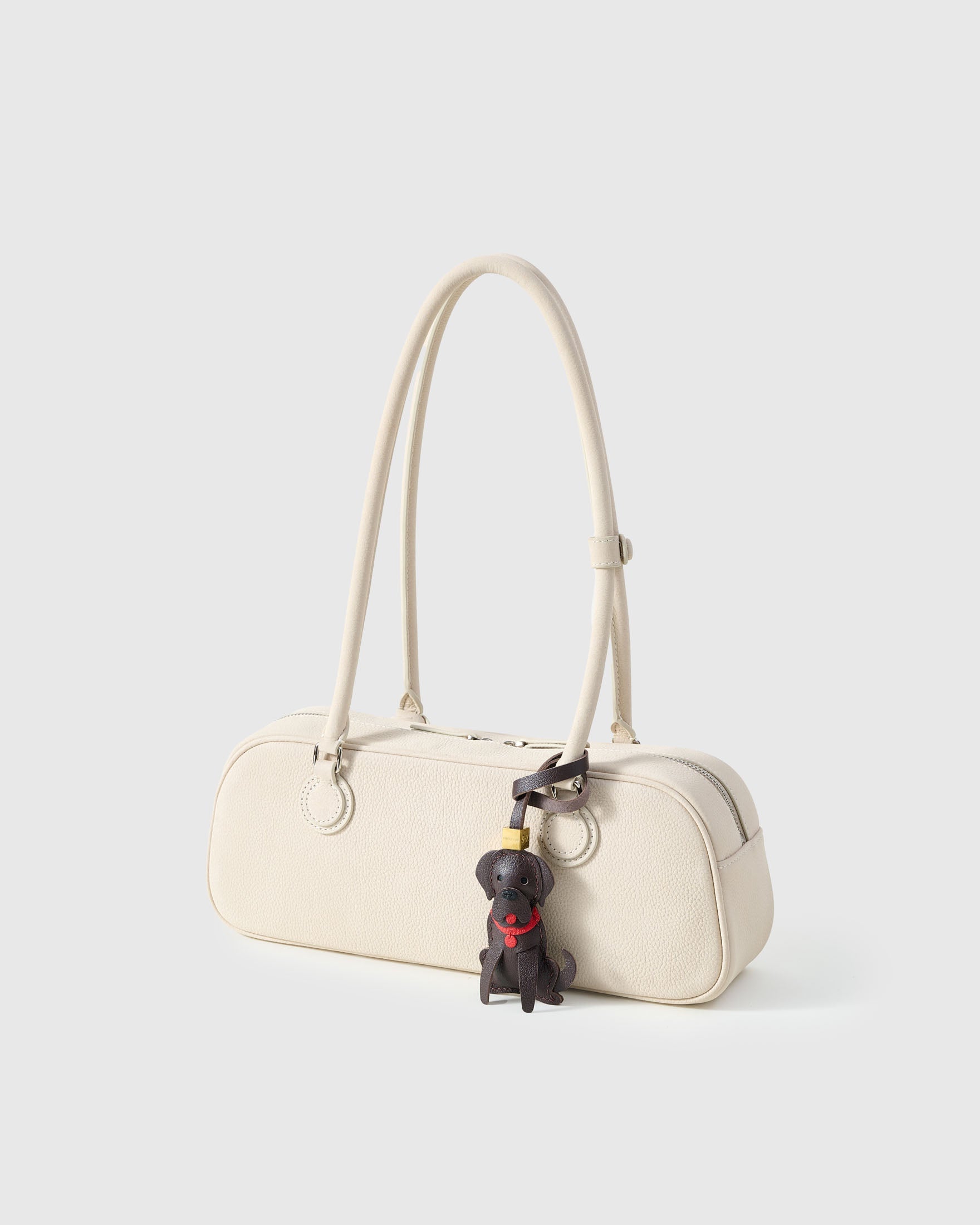 Handmade Golden Retriever leather bag charm — French Alran goatskin from a tannery founded in 1903 in Tarn, France. STICKYZOO.