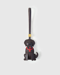 Handmade Golden Retriever leather bag charm by STICKYZOO — sitting pose in dark chocolate, hand-cut and hand-stitched French Alran goatskin over 5 days. Designed in Amsterdam.