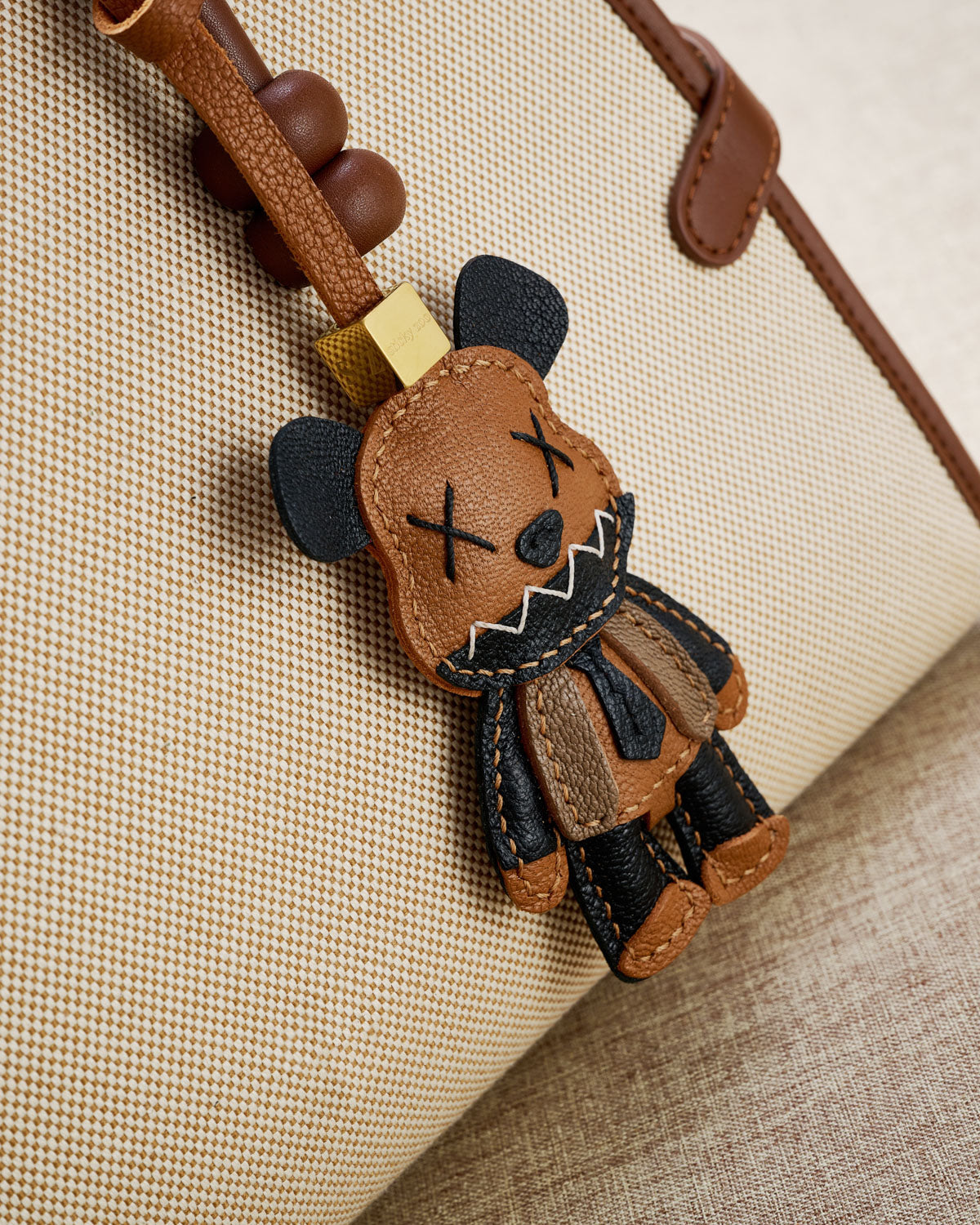 VIOLENT BEAR CHARM charm styled on a bag — a small, specific piece that turns a simple bag into a personal one.