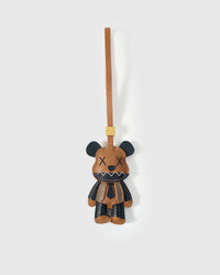VIOLENT BEAR CHARM charm handmade from French Alran genuine goatskin — X eyes. Zigzag teeth. A leather tie. This bear did not come. Three days by hand. Arrives in luxury gift packaging. Designed in Amsterdam.
