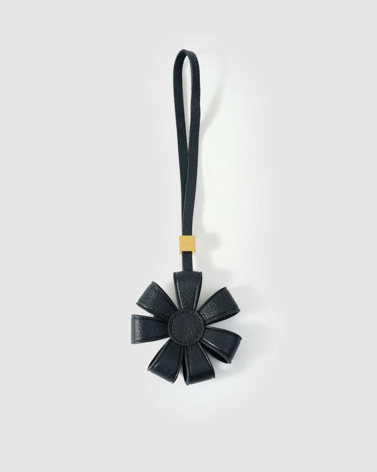 STICKYZOO Daisy Bag Charm — dual attachment option: leather strap for bags or keychain clip. French Alran goatskin.