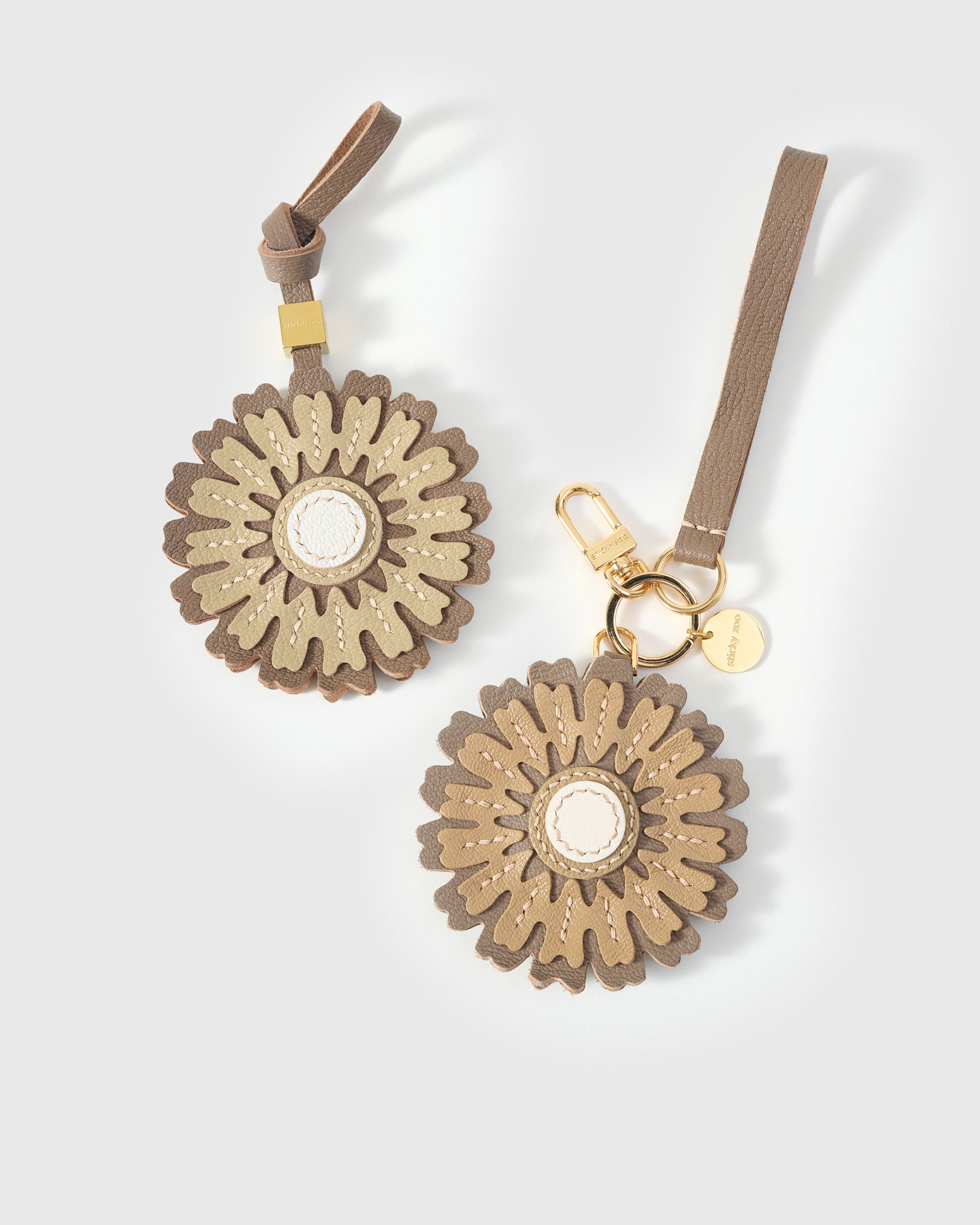STICKYZOO Sunflower Charm — hand-layered French Alran goatskin, layered sunflower petals with white centre. Designed in Amsterdam.