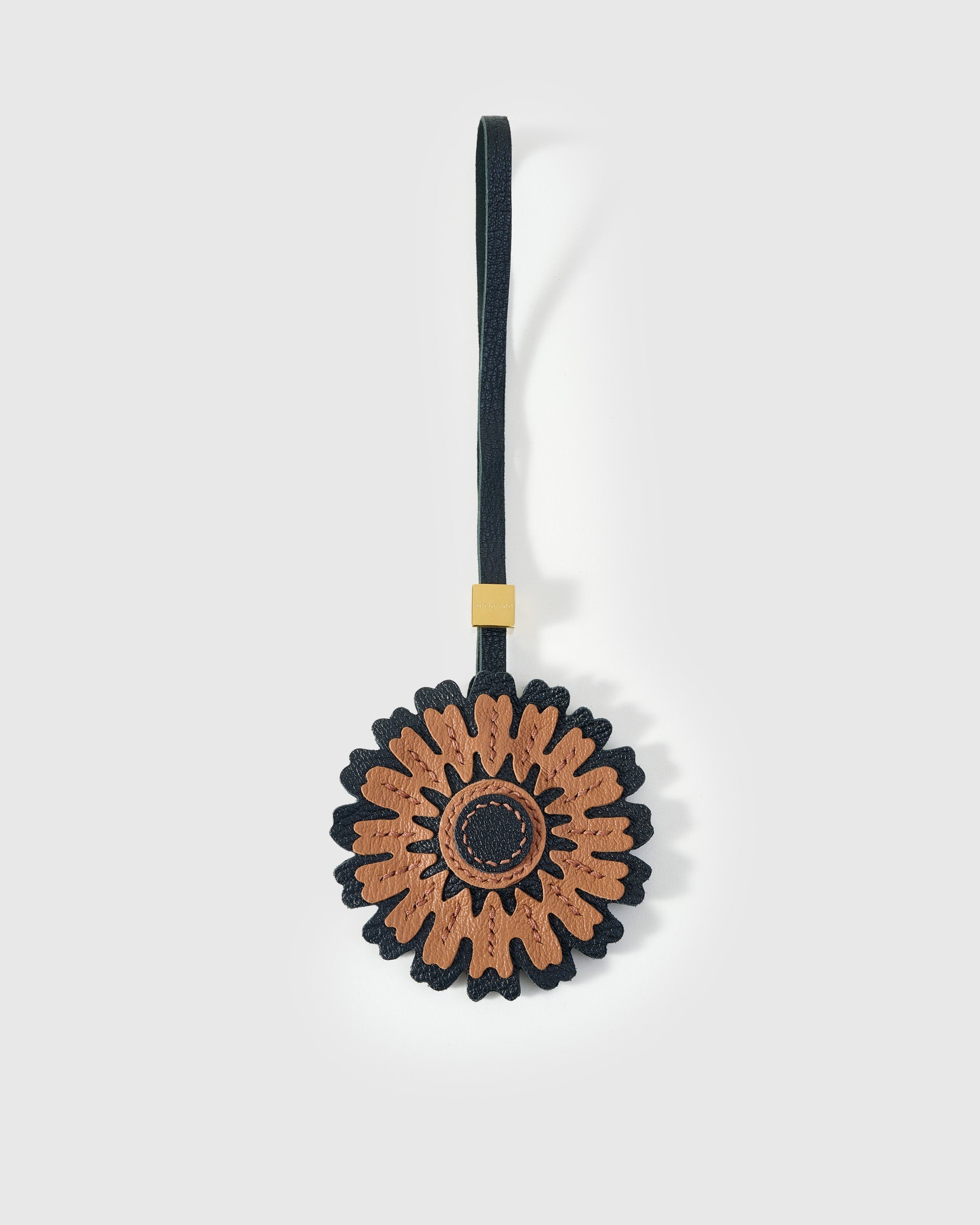 STICKYZOO Sunflower Charm in cream and olive over brown — handmade French Alran goatskin with 18K gold-plated hardware. Arrives gift-ready.