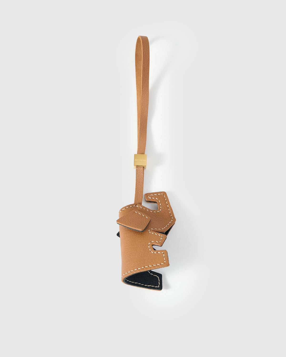 ELEPHANT CHARM charm handmade from French Alran genuine goatskin — An elephant with X eyes, a leather bow, and ears that flop.. Three days by hand. Arrives in luxury gift packaging. Designed in Amsterdam.
