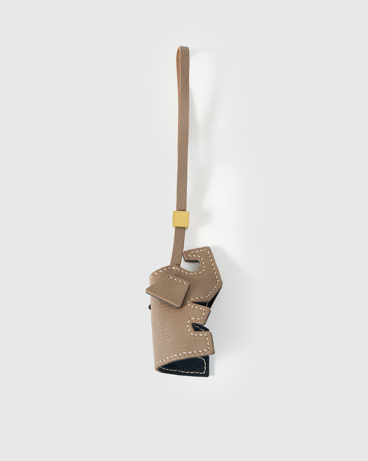 ELEPHANT CHARM charm handmade from French Alran genuine goatskin — A taupe elephant, same drooping ears, same bow, same quiet. Three days by hand. Arrives in luxury gift packaging. Designed in Amsterdam.