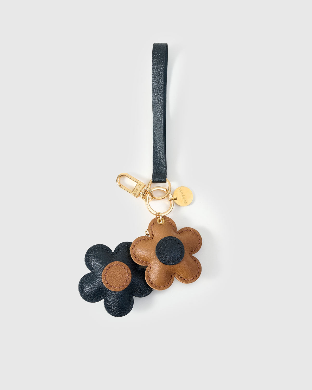 STICKYZOO Twin Flowers Charm with engraved gold hardware cube — handmade French Alran goatskin, navy with tan centres.
