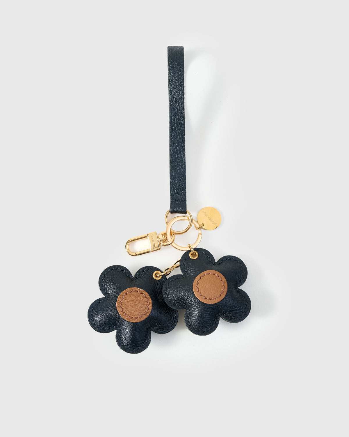 STICKYZOO Twin Flowers Charm — dual attachment option: leather strap for bags or keychain clip. French Alran goatskin.