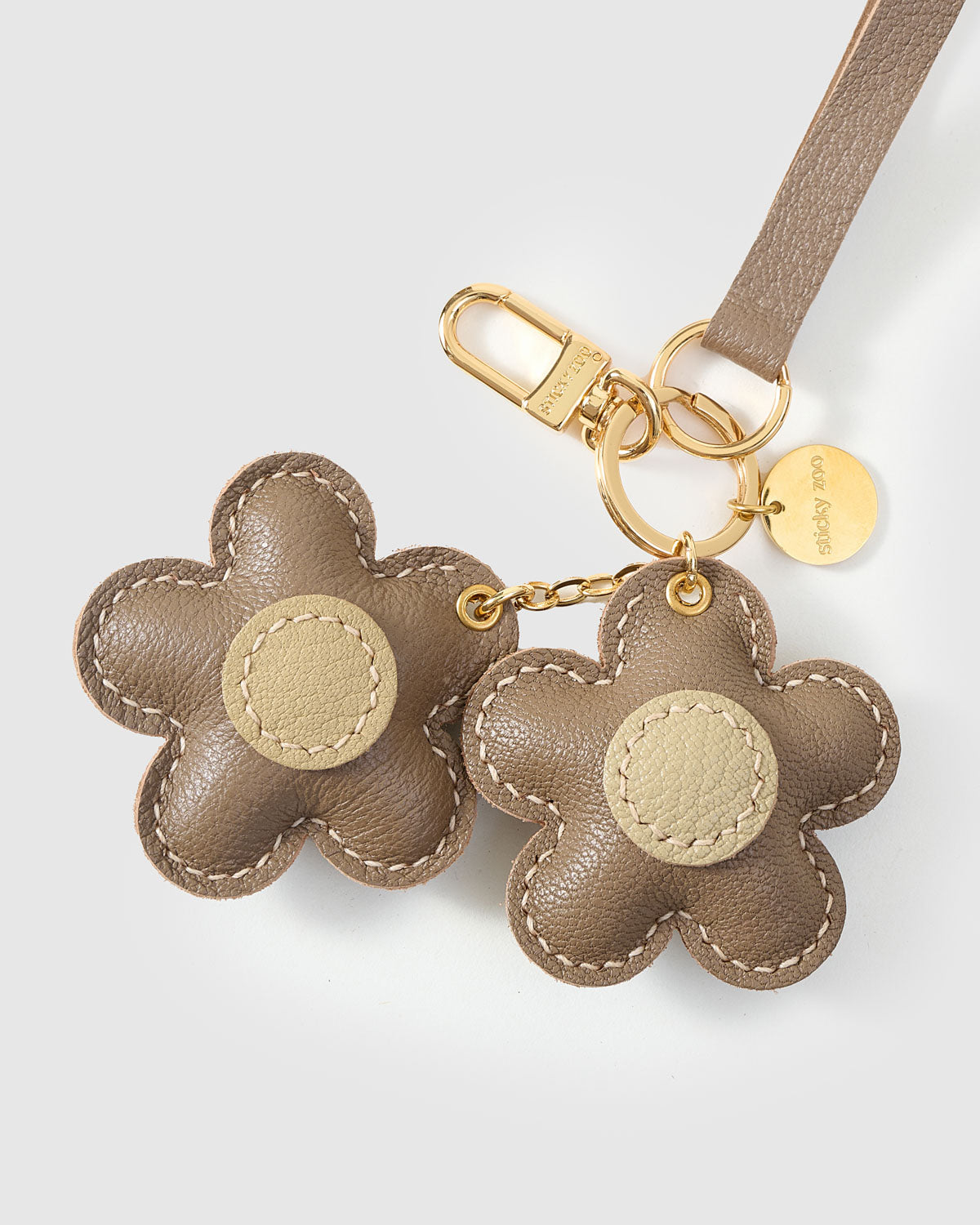 STICKYZOO Twin Flowers Charm in taupe with olive centres French Alran goatskin. Hand-cut, hand-stitched. Designed in Amsterdam.