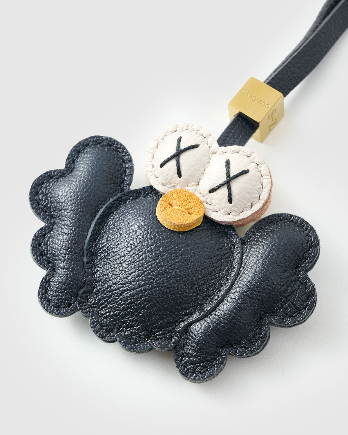 Black Hootie on an 18K gold-plated keychain clip with engraved STICKYZOO disc — clips to keys, bags or backpacks.
