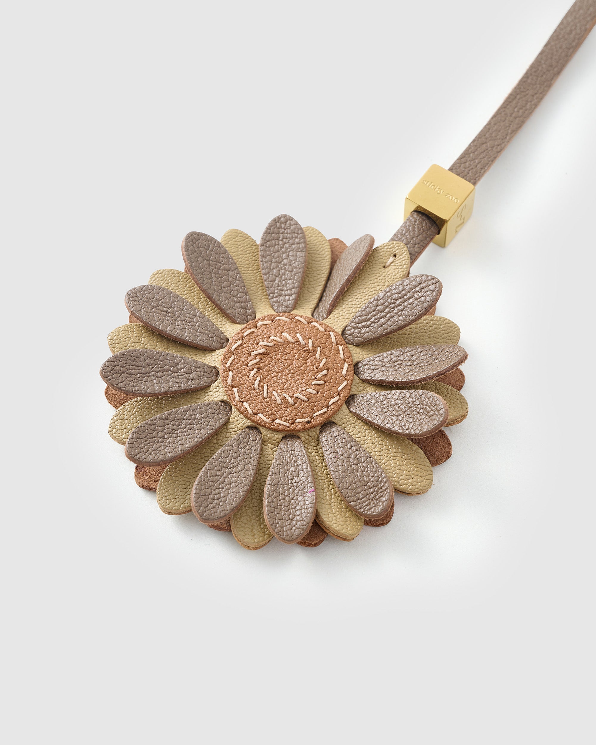 STICKYZOO Daisy Charm — hand-layered French Alran goatskin, layered daisy petals with tan centre. Designed in Amsterdam.