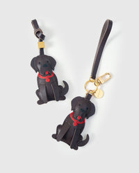 Golden Retriever leather bag charm shown in both attachment options — handmade French Alran goatskin, dual attachment. STICKYZOO Amsterdam design.