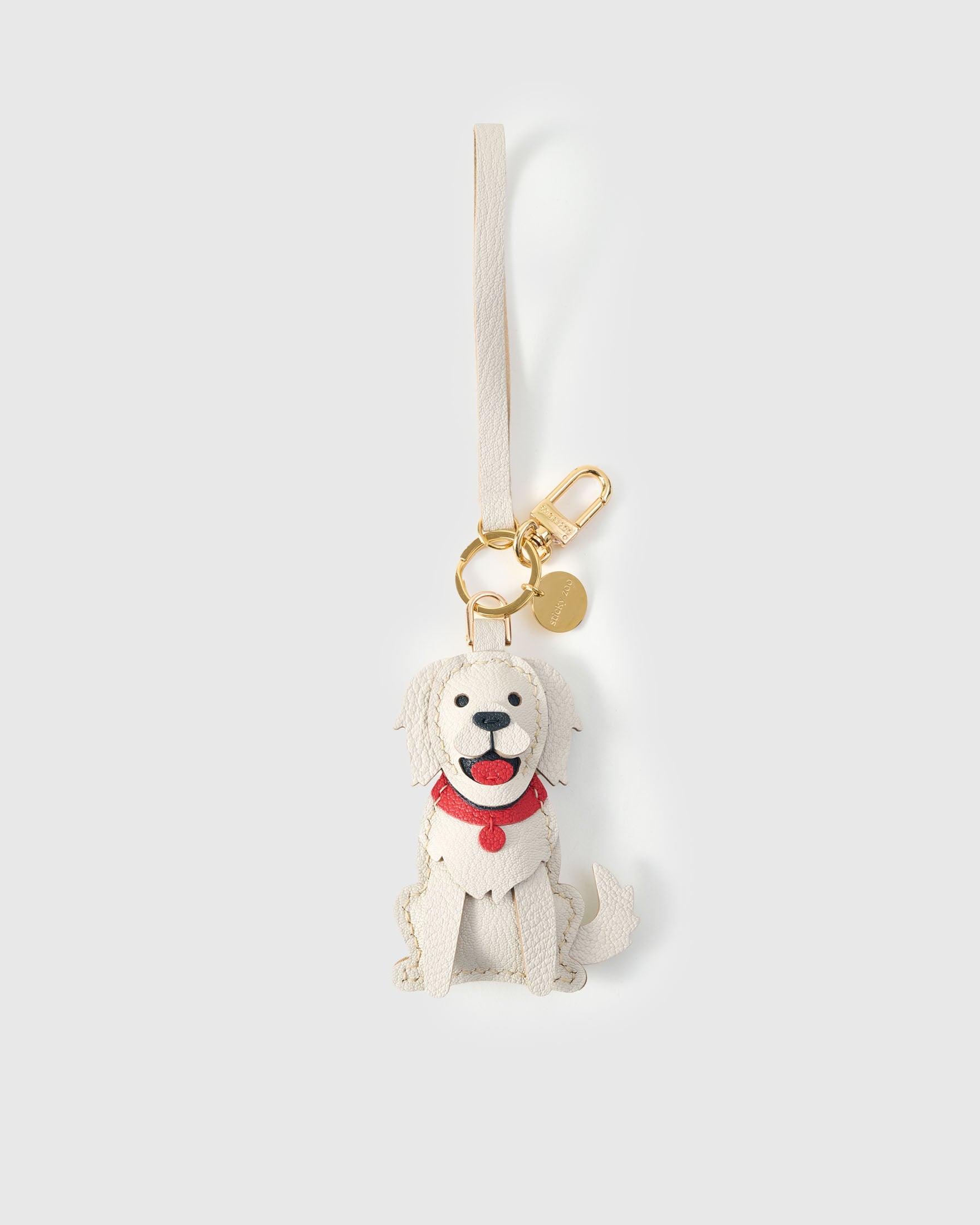Handmade Golden Retriever leather bag charm — French Alran goatskin from a tannery founded in 1903 in Tarn, France. STICKYZOO.