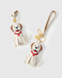 Handmade Golden Retriever leather bag charm on a handbag — 5 days of hand-cutting, stitching, and layering in French Alran goatskin. STICKYZOO.