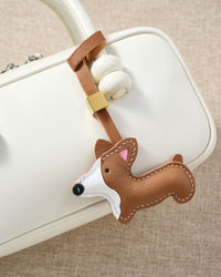 Every panel of the Pembroke Welsh Corgi charm is cut by hand and stitched through real French leather. Layered slowly for depth — no prints, no stamps.