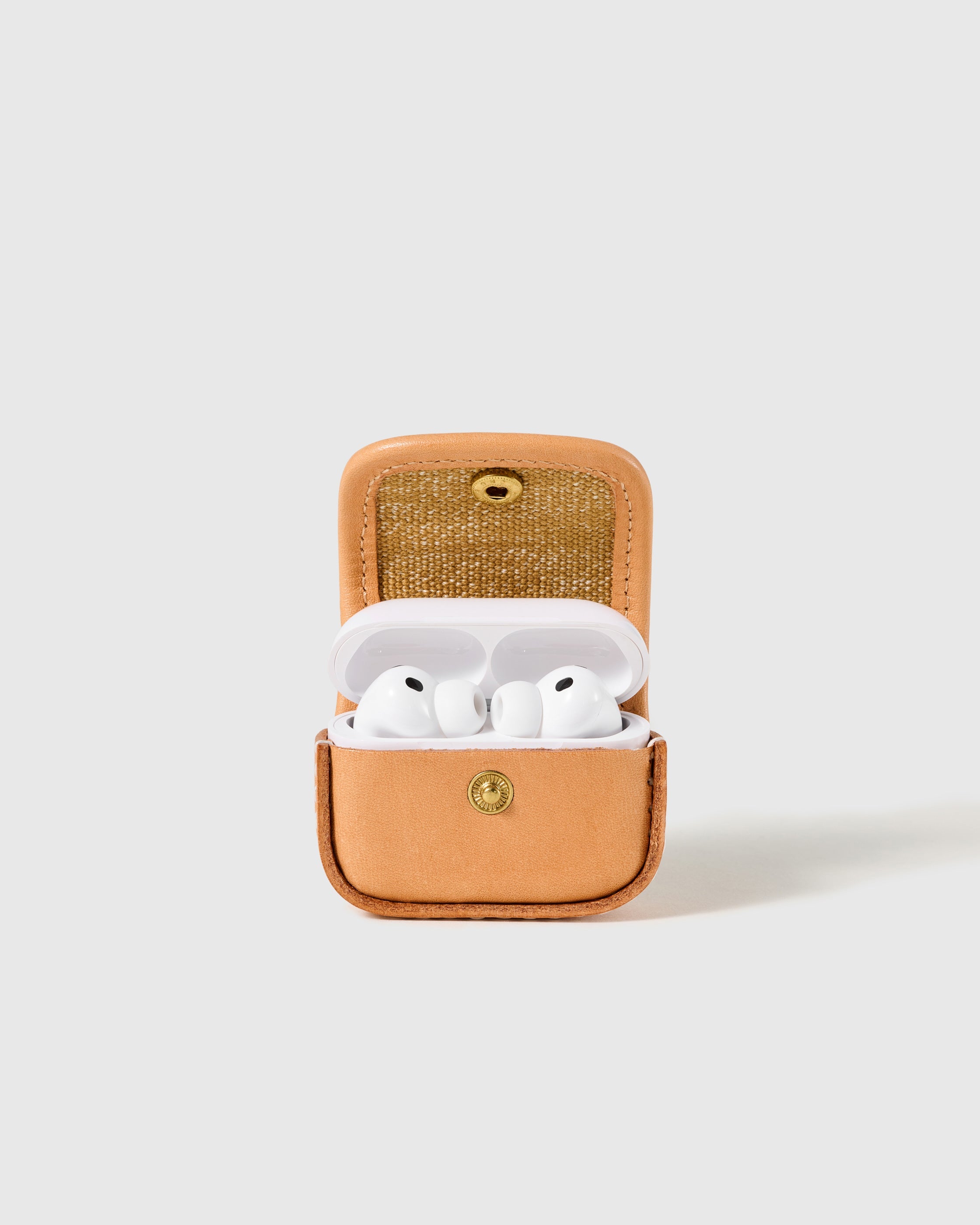 Tan STICKYZOO Mini Tote AirPods Case open to show the snap-close flap