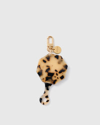 STICKYZOO folding octagonal mirror charm in Cream with tortoiseshell-style surface, gold-tone linework and branded clasp.