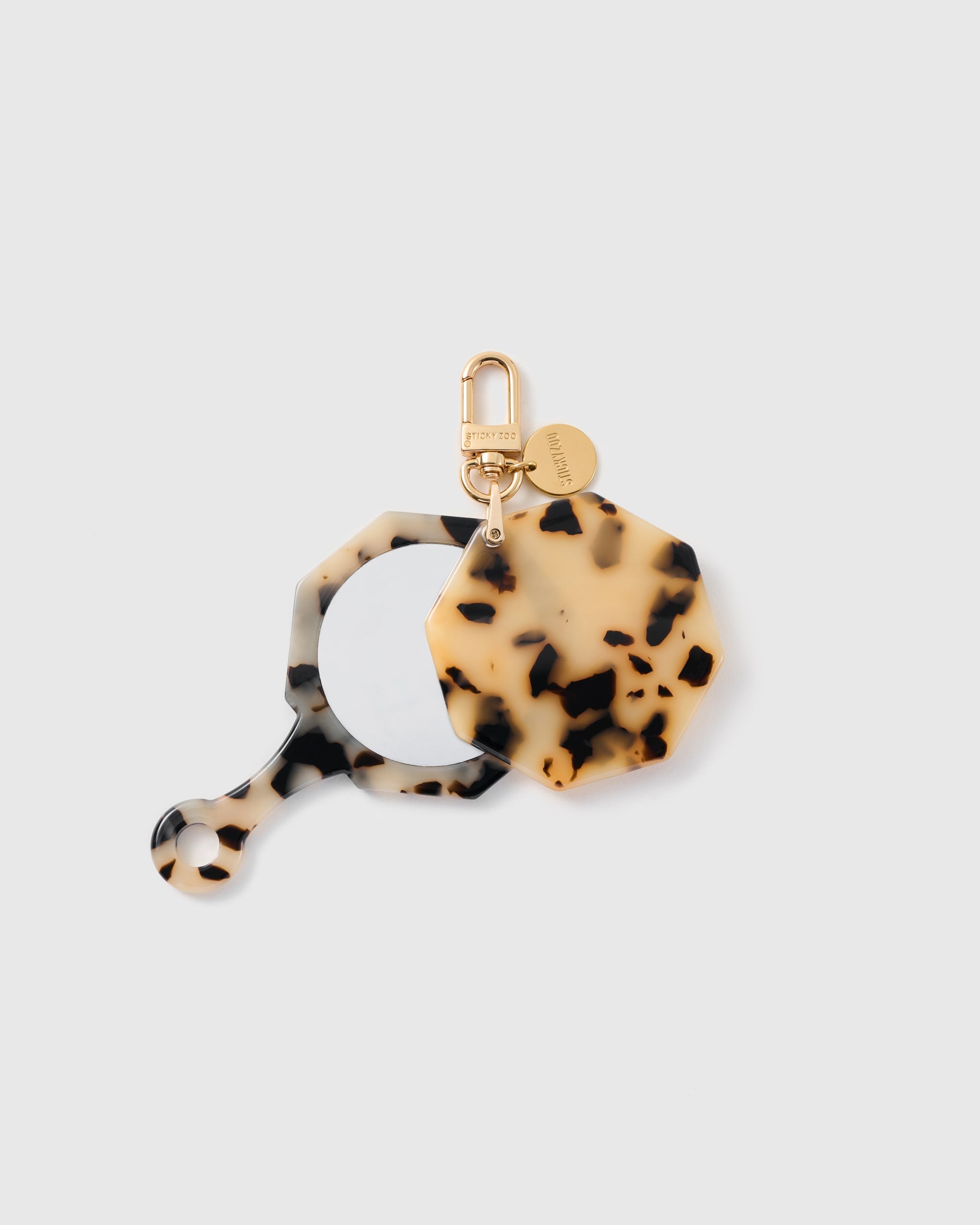 STICKYZOO Bianca Vanilla Mosaic Mirror Charm open to reveal the compact mirror beneath its cream patterned cover.